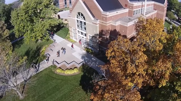 An artist's rendering of students walking on the campus of Northwestern College in Orange City, Iowa.