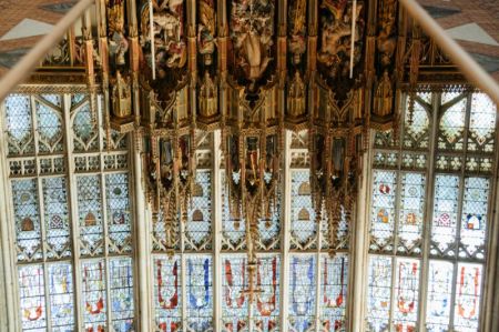 The high altar and great east window of the Gloucester Cathedral reflected into a looking mirror.