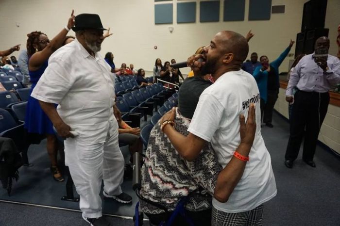 Pastor Tim Rogers hugs a mother in Dublin, Ga. during his Saving a Generation tour in June 2018.