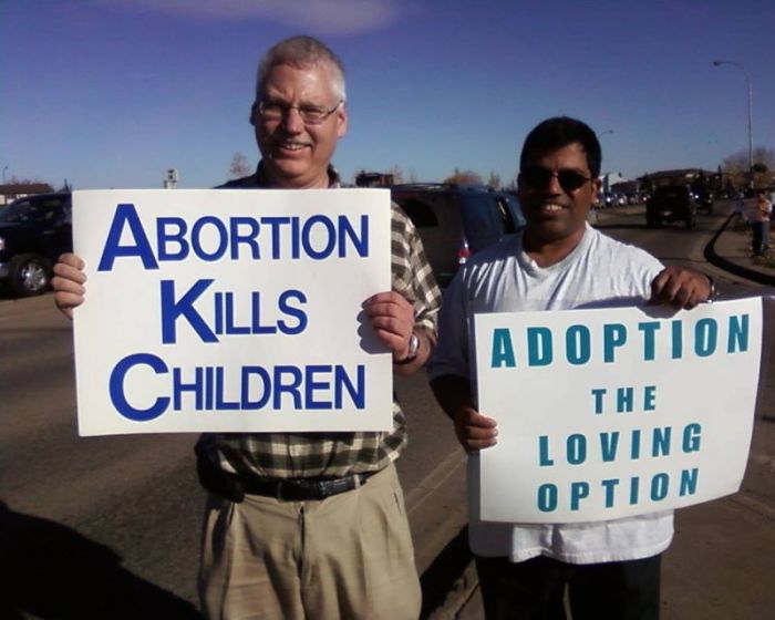 Bill Whatcott and a friend protest abortion in this photo uploaded to Facebook on Dec. 15, 2016.