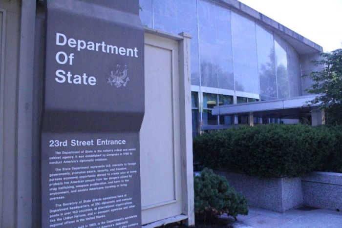 An entrance sign sits on display in front of 23rd Street entrance to the Harry S. Truman Building in Washington, D.C. on July 26, 2018.