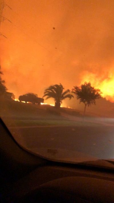 A neighborhood near Keswick dam outside of Redding, California goes up in flames as residents flee July 26, 2018.