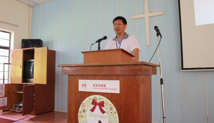 Pastor John Cao speaking in this undated photo before his imprisonment in China based on charges of illegal border crossings.