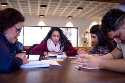 Students pray during a bible study hosted by InterVarsity Christian Fellowship at Montclair State University in New Jersey.