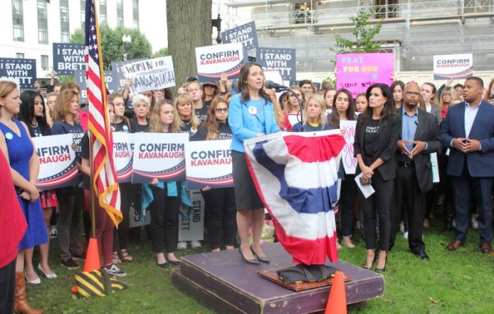 Carrie Severino of the Judicial Crisis Network speaks to supporters of Judge Brett Kavanaugh outside the Russell Senate Building on Sept. 27, 2018.