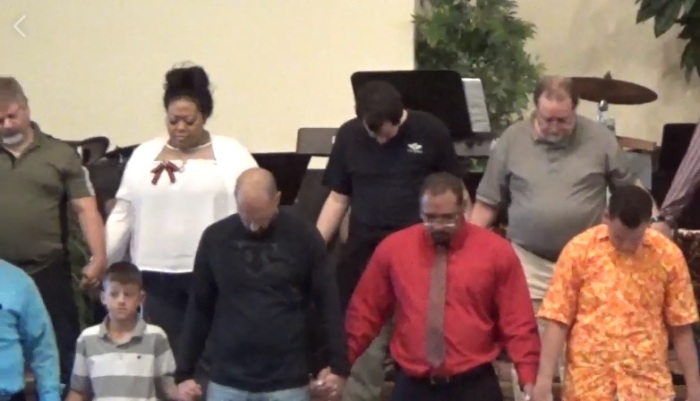 Congregants from Faith Baptist Church and Mount Vernon Church in Raleigh County, West Virginia pray for racial healing during a joint worship service at Faith Baptist Church's campus in Prosperity on Sept. 30, 2018.