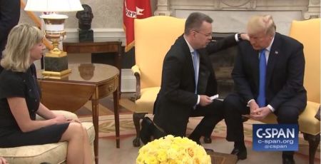 Pastor Andrew Brunson and his wife, Norine, and their family pray for President Donald Trump in the Oval Office at the White House in Washington, D.C., on Oct. 13, 2018.