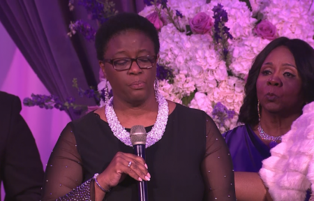 Serita Jakes, wife of Bishop T.D. Jakes (R) struggles to maintain her composure as she listens to Allison Jean, mother of Botham Jean, as she speaks after receiving the Lady of Grace award during the God's Leading Ladies gala at Bishop T.D. Jakes' Woman, Thou Art Loosed! Master Class conference on Oct. 17, 2018.