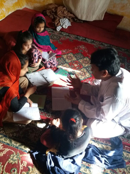 Afghan interpreter Muhammad Kamran speaks with his four girls.