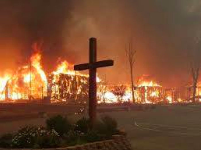 The cross photo was taken by Tyler Frank and Elizabeth Osborn as they escaped the flames. 