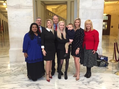 Brittany and Noah (center) with her Babies Go to Congress team 