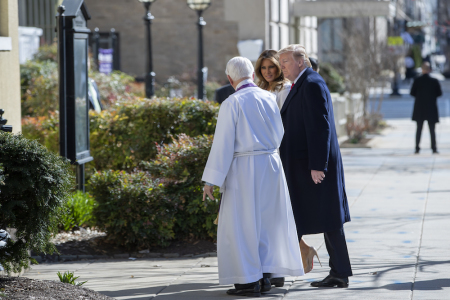 U.S. President Donald J. Trump (R) and first lady Melania Trump (C) are greeted by Reverend W. Bruce McPherson (L) as they arrive to attend services at St. John's Episcopal Church March 17, 2019, in Washington, DC, USA. The Trumps are attending church on St. Patrick's Day.