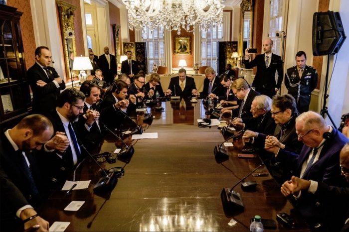 Brazil President Jair Bolsonaro prays with evangelical leaders in Washington, D.C. on March 19, 2019.