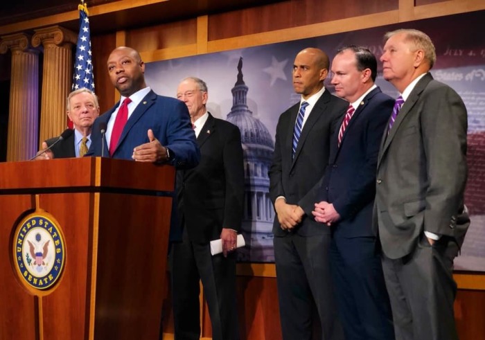 Republican South Carolina Sen. Tim Scott (podium) discusses the First Step Act with other legislators in December 2018.