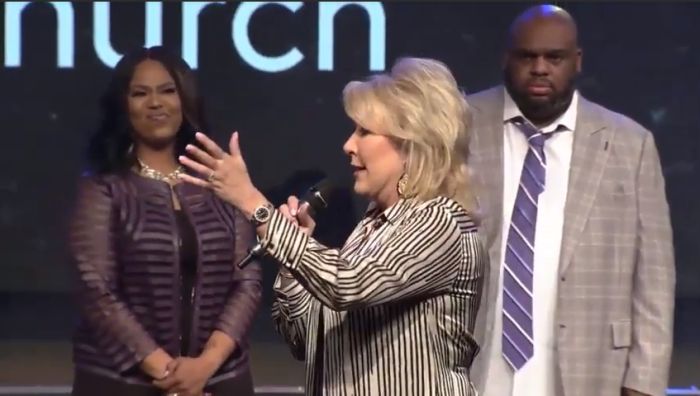 Pastor Hope Carpenter (foreground) defends Pastors John and Aventer Gray at Relentless Church in Greenville, S.C. on March 31, 2019.