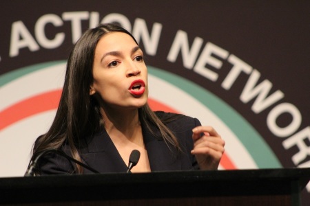 Rep. Alexandria Ocasio-Cortez, D-N.Y., speaks at the National Action Network convention in New York on Friday April 5, 2019.