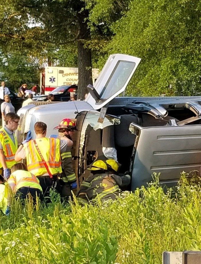 First responders inspect the crashed van of the Shiloh Baptist Church.