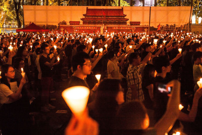 Thousands of people hold candles during a candlelight vigil on June 4, 2016 in Hong Kong, Hong Kong. Thousands of people in Hong Kong participated in an annual candlelight vigil in Hong Kong on June 4 to commemorate the killing of protesters in Beijing's Tiananmen Square in 1989. 