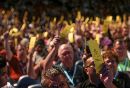 Nearly 9,000 Southern Baptist messengers at the 2019 Southern Baptist Convention Annual Meeting June 11, 2019, vote to pass an amendment regarding churches and sexual abuse. 