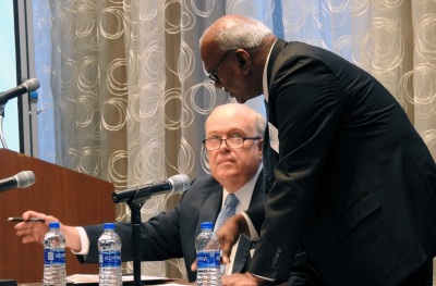 Bishop Michael McKee, president of the United Methodist Church's General Council on Finance and Administration, confers with Moses Kumar, GCFA’s top executive, on July 19, 2019 in Dallas, Texas. 