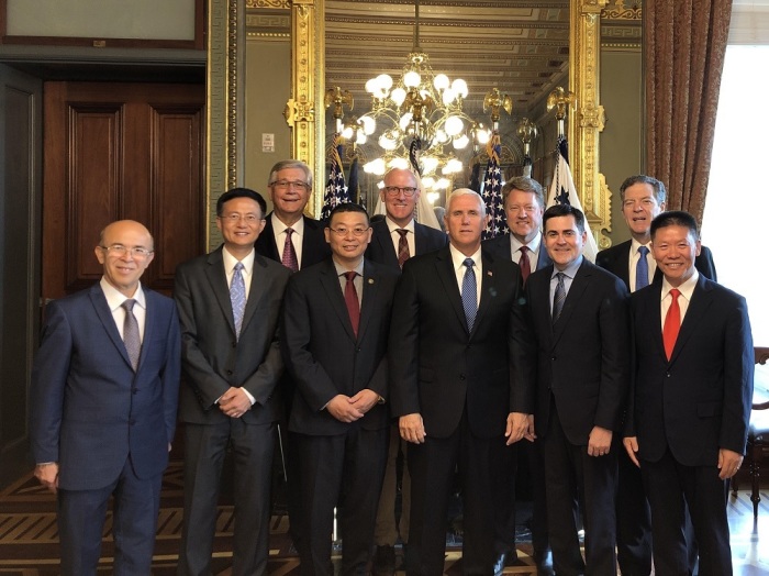 Vice President Mike Pence poses for a picture with advocates involved in the International Religious Freedom Roundtable during a meeting on China's religious freedom abuses on Aug. 5, 2019.