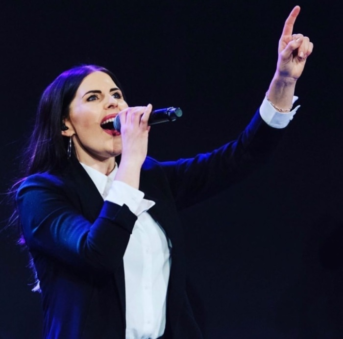 Chelsea Taylor, worship leader at the Hills campus of Hillsong Worship in Sydney, Australia, leading worship in August 2019. 