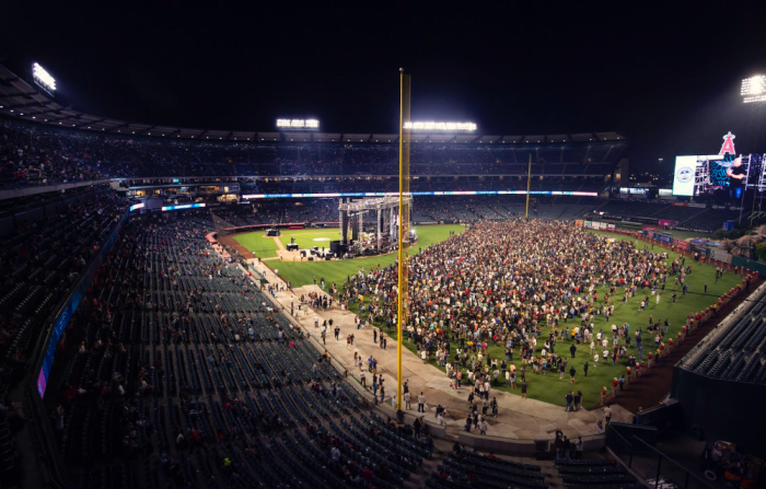 Attendees respond to Laurie's Gospel invitation at the second night of SoCal Harvest in Anaheim, California, August 24, 2019. 