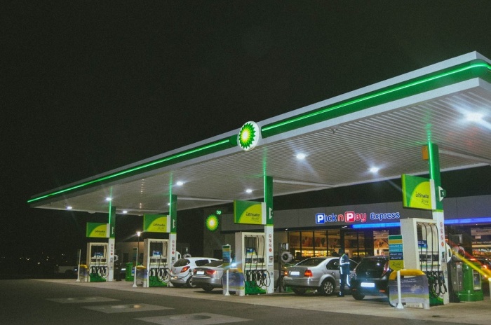 Drivers fill up their cars with gas at a BP station.