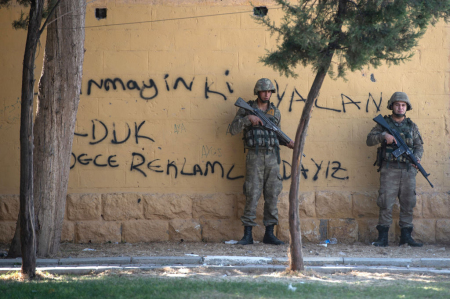 Turkish soldiers stand guard near the Turkey Syrian border on October 10, 2019, in Akcakale, Turkey. The military action is part of a campaign to extend Turkish control of more of northern Syria, a large swath of which is currently held by Syrian Kurds, whom Turkey regards as a threat. 