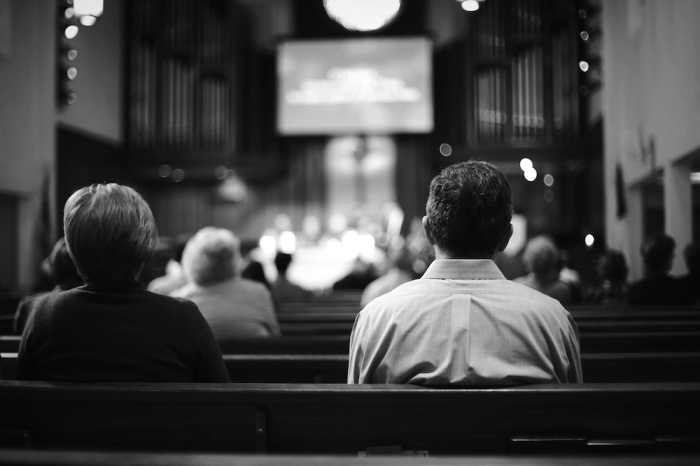 People sit in a church.