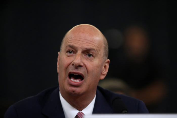 Gordon Sondland, the U.S ambassador to the European Union, makes an opening statement before testifying to the House Intelligence Committee in the Longworth House Office Building on Capitol Hill November 20, 2019 in Washington, DC. The committee heard testimony during the fourth day of open hearings in the impeachment inquiry against U.S. President Donald Trump, whom House Democrats say held back U.S. military aid for Ukraine while demanding it investigate his political rivals and the unfounded conspiracy theory that Ukrainians, not Russians, were behind the 2016 computer hacking of the Democratic National Committee.