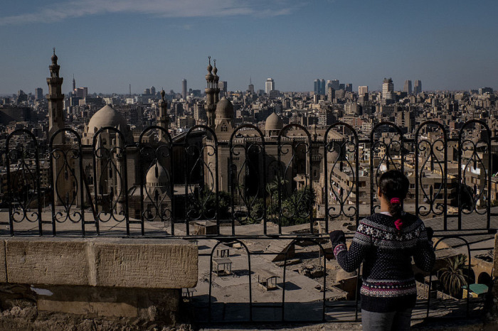 The young girl looks over Cairo's horizon on December 16, 2016 in Cairo, Egypt.