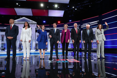 Democratic presidential candidates (L-R) Sen. Cory Booker (D-N.J.), Rep. Tulsi Gabbard (D-Hawaii), Sen. Amy Klobuchar (D-Minn.), South Bend, Indiana Mayor Pete Buttigieg, Sen. Elizabeth Warren (D-Mass.), former Vice President Joe Biden, Sen. Bernie Sanders (I-Vt.), and Sen. Kamala Harris (D-Calif.), arrive on stage before the start of the Democratic Presidential Debate at Tyler Perry Studios November 20, 2019 in Atlanta, Georgia. 