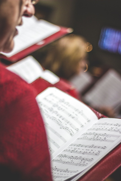 Chorus member singing.