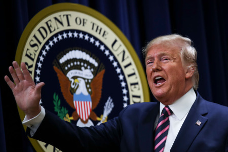 U.S. President Donald Trump waves after speaking at a White House Mental Health Summit in the South Court Auditorium of the Eisenhower Executive Office Building at the White House on December 19, 2019, in Washington, D.C. 