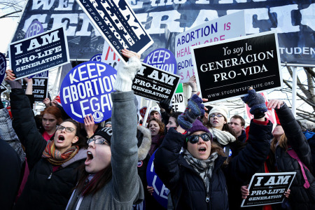 Pro-life activists try to block pro-choice activists as the annual March for Life passes by in front of the U.S. Supreme Court on January 22, 2015, in Washington, D.C. Pro-life activists gathered in the nation's capital to mark the 1973 Supreme Court Roe v. Wade decision that legalized abortion. 