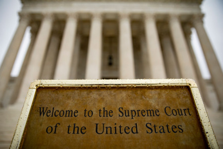 A welcome sign sits at the base of the steps to the U.S. Supreme Court on December 16, 2019, in Washington, D.C. 