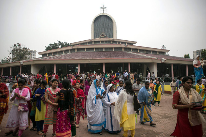 People leave service at a Christian church on March 20, 2016, in Dhaka, Bangladesh. 