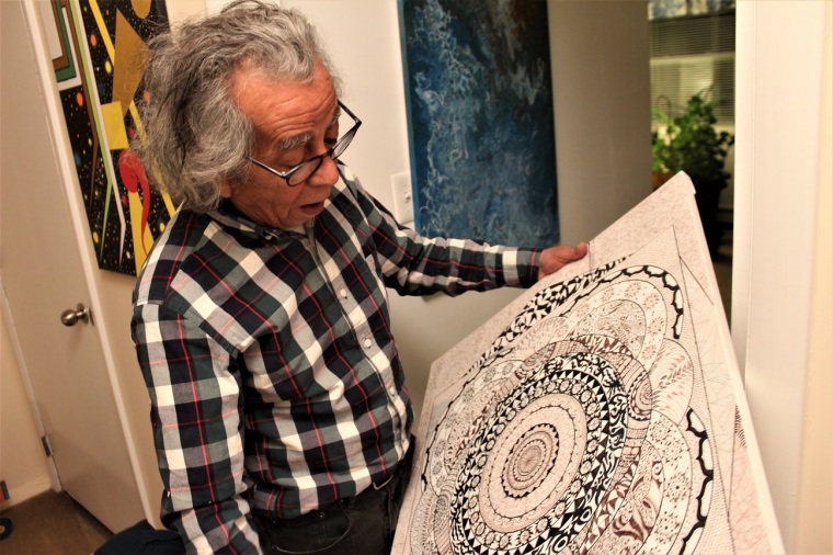 Armando Martinez shows his artwork inside his affordable home in East New York, Brooklyn.