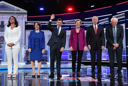 Democratic presidential candidates (L-R) Rep. Tulsi Gabbard (D-Hawaii), Sen. Amy Klobuchar (D-Minn.), South Bend, Indiana Mayor Pete Buttigieg, Sen. Elizabeth Warren (D-Mass.), former Vice President Joe Biden, and Sen. Bernie Sanders (I-Vt.) arrive on stage before the start of the Democratic Presidential Debate at Tyler Perry Studios November 20, 2019 in Atlanta, Georgia.