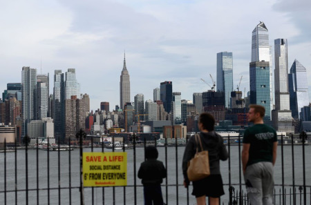 People look at the Manhattan skyline on April 2, 2020 as seen from Weehawken, New Jersey. 