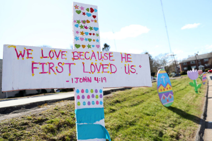 Hand painted decorations line the driveway during a drive-through Easter photo session at Story Heights Church on April 11, 2020, in Newton, Massachusetts. The coronavirus (COVID-19) pandemic has forced the church to move their Easter services online to comply with social distancing protocols. A stay-at-home order has been put in place by Massachusetts Governor Charlie Baker through May 4. 