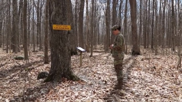 U.S. Army Chaplain Amy Smith prays while walking on the Spiritual Fitness Trail at Fort Drum in New York. 