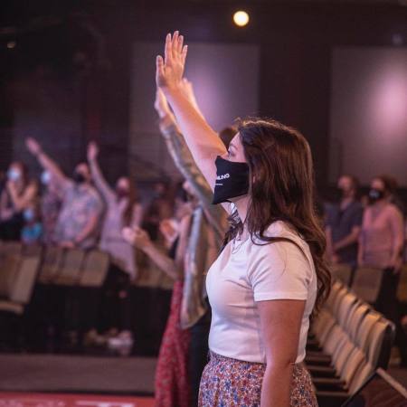 Attendees at Fellowship Church worship with face masks, May 3, 2020.