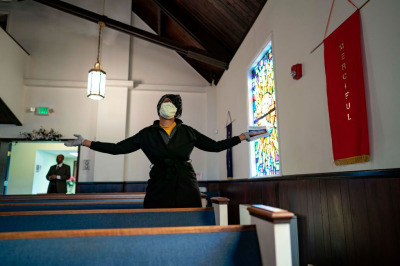 Congregants attend Sunday morning Easter services at The Friendship Baptist Church on April 12, 2020 in Baltimore, Maryland. The church Pastor, Alvin Gwynn, has decided to keep his church open for Easter Sunday despite an order from Maryland Governor Larry Hogan to remain closed amid the Coronavirus pandemic.