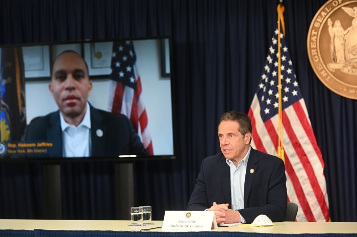 New York Gov. Andrew M. Cuomo talks to U.S. Congressman Hakeem Jeffries via Zoom during his daily coronavirus briefing at his New York City office on Saturday, May 9, 2020. 