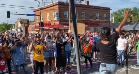 People worship near the site where George Floyd was killed in Minneapolis, Minn.