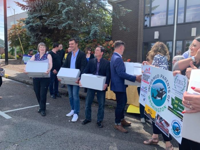 Members of Informed Parents of Washington drop off signatures petitioning for a referendum against recent sex-ed legislation in Olympia, Washington earlier this year.