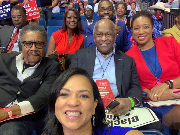 Herman Cain (C) poses with Black Voices for Trump a rally for President Donald Trump in Tulsa, Okl. on June 20, 2020.