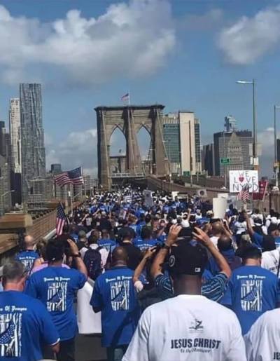 Clergy and NYPD gather on the Brooklyn Bridge in New York City on July 15, 2020.